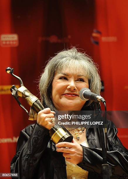 Hong Kong actress Susan Shaw holds the best supporting actress award for her role in the movie "The Pye-Dog" at the 27th Hong Kong Film Awards in...