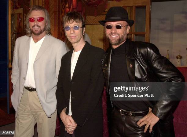 S rock/disco group, The Bee Gees pose for the photographer at a press conference April 23, 2001 in New York prior to announcing the release of their...