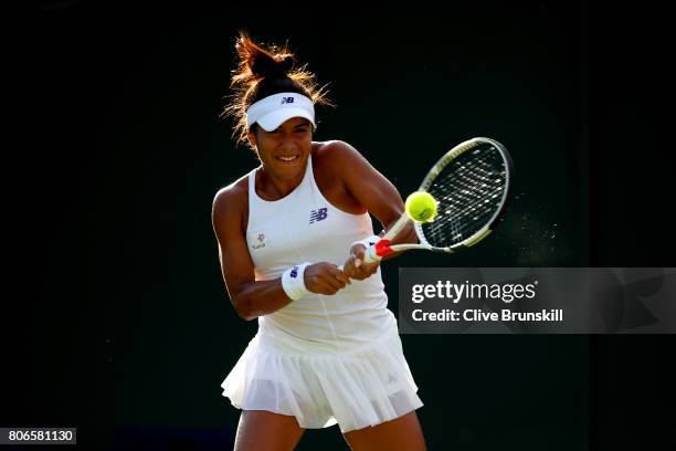 Heather Watson of Great Britain plays a backhand during the Ladies Singles first round match against Maryna Zanevska of Belgium on day one of the...