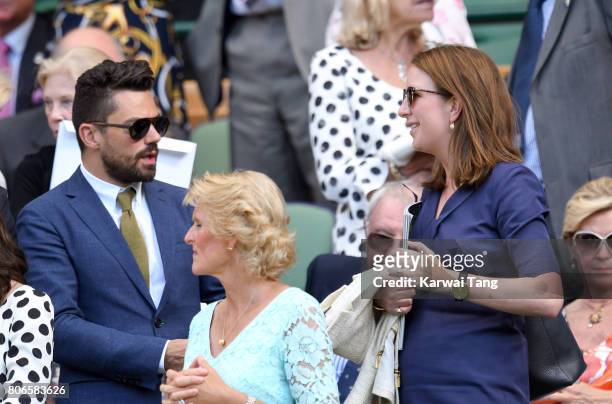 Dominic Cooper and Rebecca Deacon attend day one of the Wimbledon Tennis Championships at the All England Lawn Tennis and Croquet Club on July 3,...