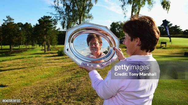 Alison Nicholas of Beau Desert Golf Club poses with the trophy after winning, on the fourth play off hole, the Titleist and FootJoy Women's PGA...