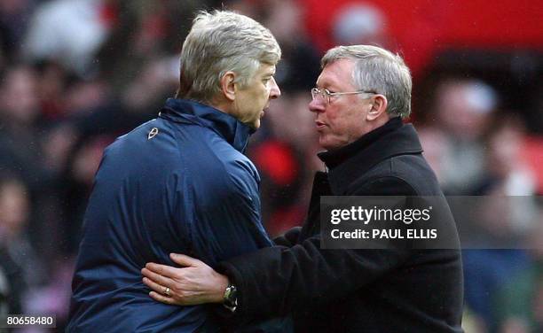 Manchester United manager Sir Alex Ferguson shakes hands with Arsenal manager Arsene Wenger after their English Premier League football match at Old...