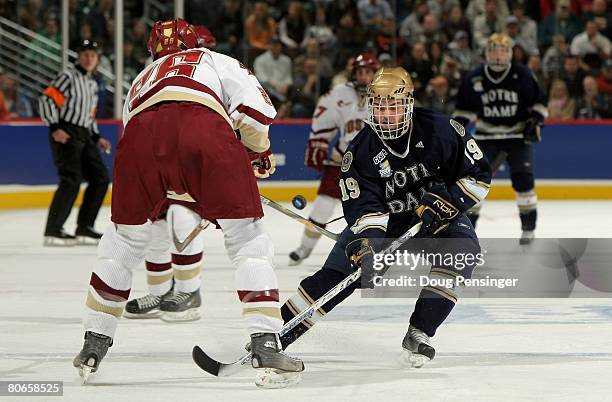 Ben Ryan of the Notre Dame Fighting Irish tries to get the puck past Nick Petrecki of the Boston College Golden Eagles in the 2008 NCAA Frozen Four...