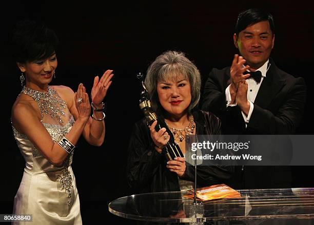 Hong Kong actress Susan Shaw celebrates after winning the Best Supporting Actress for her performance in The Pye-Dog during the 27th Hong Kong Film...