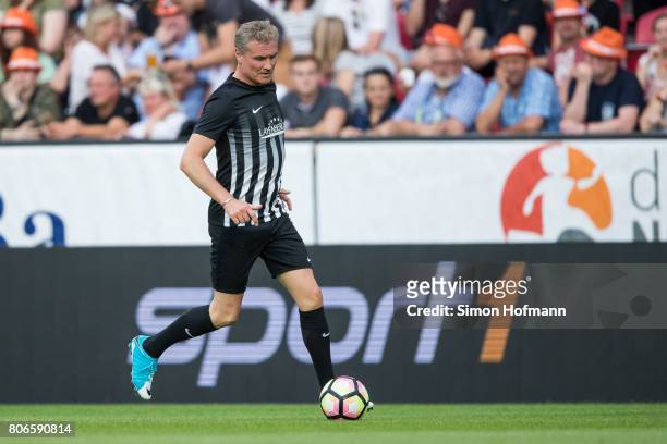 David Coulthard of Schumacher and Friends controls the ball during the Champions for Charity Friendly match at Opel Arena on July 3, 2017 in Mainz,...