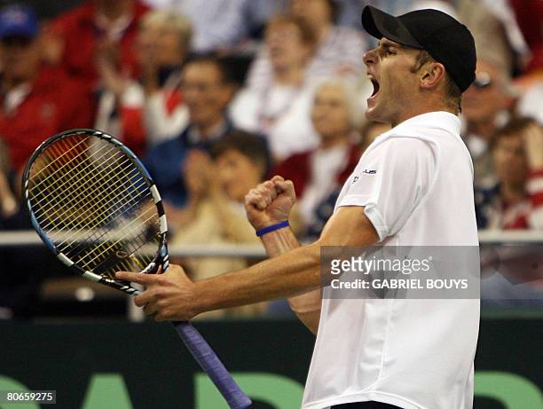 Andy Roddickof the US celebrates against France's Paul-Henri Mathieu on April 13 during their quarterfinal tennis match of the Davis Cup World Group...