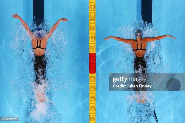 Jemma Lowe of United Kingdom and Mari Lize Retief of South Africa compete in the Women's 100m Butterfly Final during the ninth FINA World Swimming...