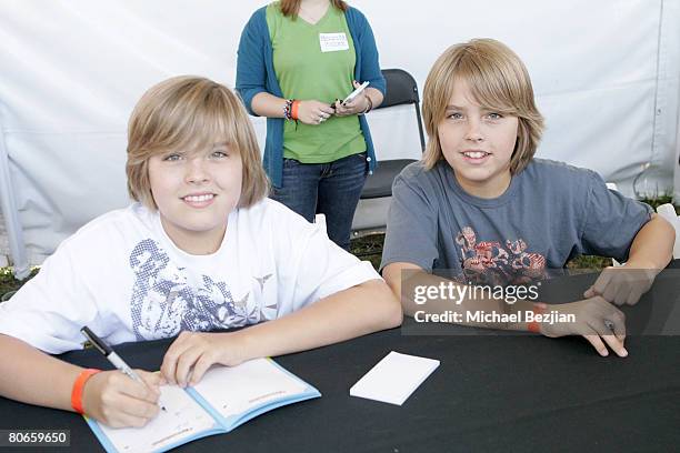 Dylan Sprouse and Cole Sprouse sign autographs at the Camp Ronald McDonald 15th Annual Family Halloween Carnival on October 21, 2007 in Westwood,...