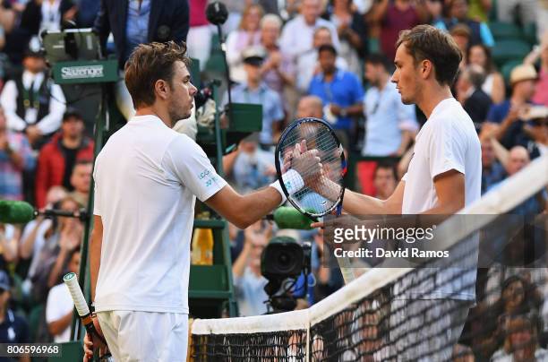 Stan Wawrinka of Switzerland and Daniil Medvedev of Russia shake hands after their Gentlemen's Singles first round match on day one of the Wimbledon...