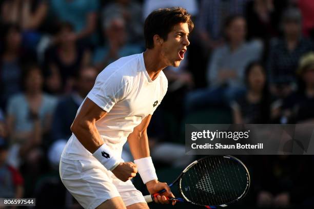 Aljaz Bedene of Great Britain celebrates during the Gentlemen's Singles first round match against Ivo Karlovic of Croatia on day one of the Wimbledon...