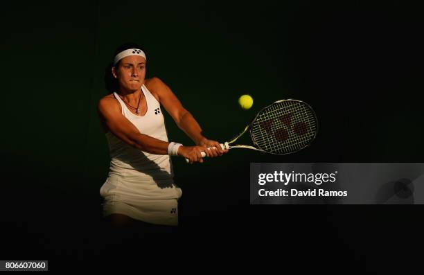 Anastasija Sevastova of Latvia plays a backhand during the Ladies Singles first round match against Yulia Putintseva of Kazakhstan on day one of the...