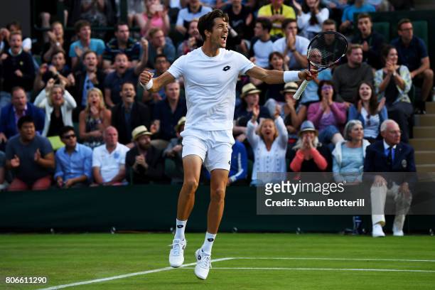 Aljaz Bedene of Great Britain celebrates victory after the Gentlemen's Singles first round match against Ivo Karlovic of Croatia on day one of the...