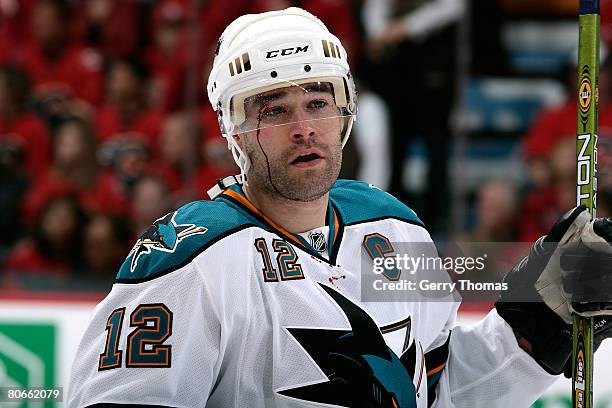 Patrick Marleau of the San Jose Sharks skates to the bench bloodied after being checked by the Calgary Flames in Game 3 of the 2008 NHL Western...