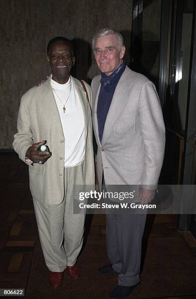 Actors Brock Peters and Charlton Heston arrive at the screening of "Soylent Green" August 12, 2000 at the Eileen Norris Theater on the campus of USC...