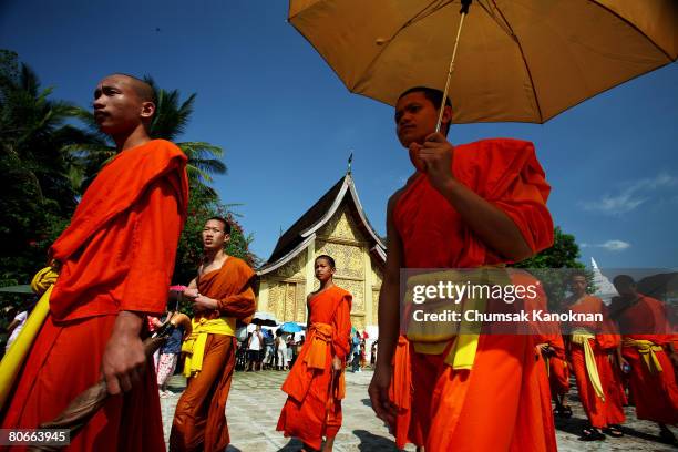 Laos Buddhist monks parade pass Wat Xieng Thong during the Songkran festival on April 14 in Luang Prabang, Laos. . The Songkran Festival runs from...