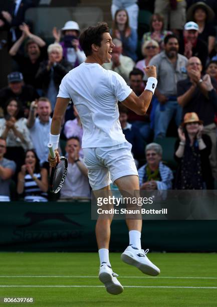 Aljaz Bedene of Great Britain celebrates victory after the Gentlemen's Singles first round match against Ivo Karlovic of Croatia on day one of the...