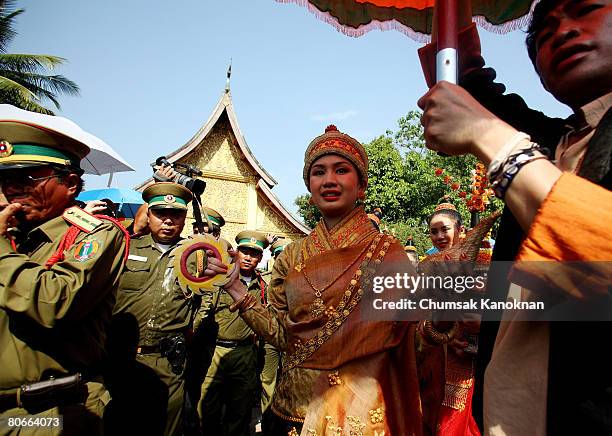 Laos lady in ancient custome parade pass Wat Xieng Thong during the Songkran festival on April 14 in Luang Prabang, Laos. The Songkran Festival runs...