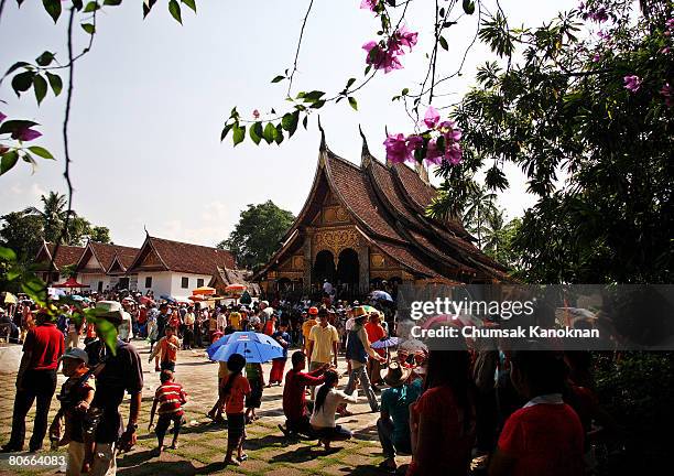 Laos people parade to Wat Xieng Thong during the Songkran festival on April 14 in Luang Prabang, Laos. The Songkran Festival runs from April 13 -...