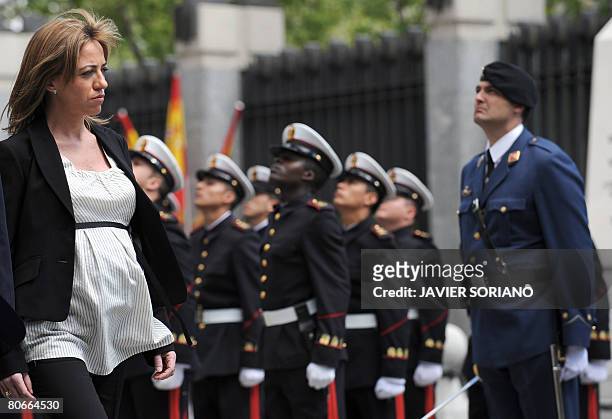 Spain's new Defence Minister Carme Chacon reviews a contingent of troops in a ceremony at the defence ministry after being sworn into office earlier...