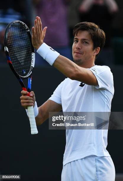 Aljaz Bedene of Great Britain celebrates victory after the Gentlemen's Singles first round match against Ivo Karlovic of Croatia on day one of the...