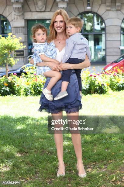 Wilma Elles poses with her twins, son Milat and daughter Melodi during a photo session on June 27, 2017 in Munich, Germany.