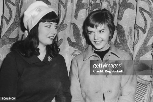 Teenage debutantes Dominie Riley-Smith and the Hon Penelope Allsopp at the Berkeley Hotel, London, 17th March 1958. They are hoping to be chosen by...