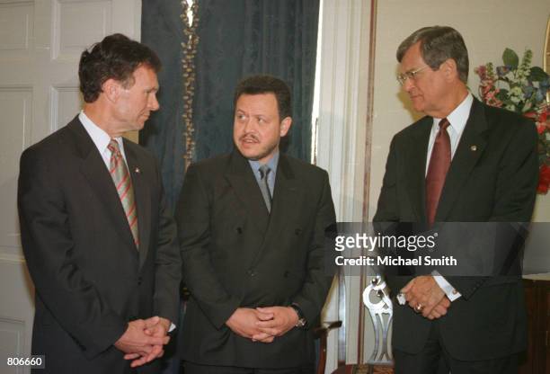 King Abdullah of Jordan, center, along with Senate Minority Leader Thomas Daschle of S.D., left, and Senate Majority Leader Trent Lott of Miss., talk...