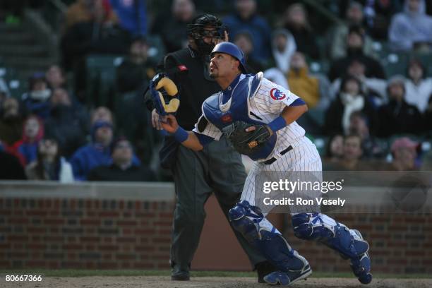 Geovany Soto of the Chicago Cubs chases a foul ball during the game against the Milwaukee Brewers at Wrigley Field in Chicago, Illinois on April 2,...