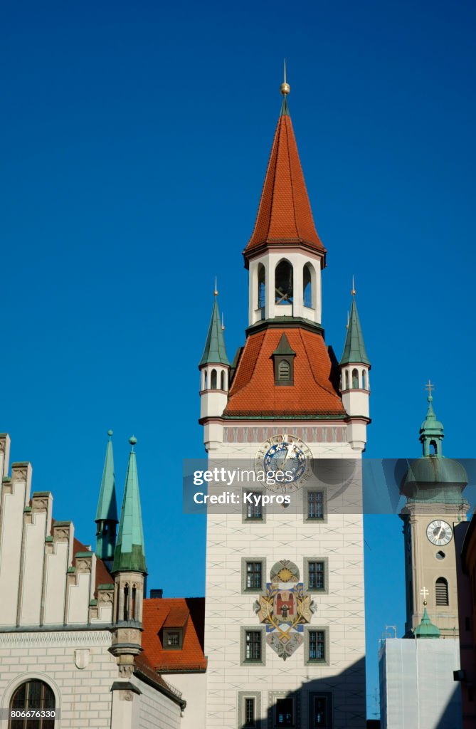 Europe, Germany, Munich, View Of The Old Town Hall Bell Tower With The Heilig-Geist-Kirche Holy Spirit Church, Marienplatz Square