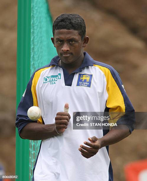 Sri Lanka bowler Ajantha Mendis tosses a ball before delivering during practice April 14, 2008 at the Beausejour Cricket Grounds in Gros Islet, Saint...
