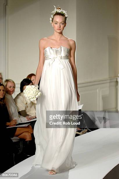 Model walks the runway during the Oscar de la Rental Bridal Collection show at Park Avenue Armory on April 14, 2008 in New York City.