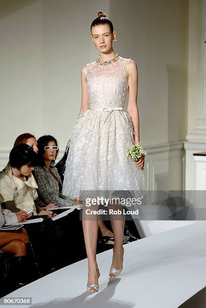 Model walks the runway during the Oscar de la Rental Bridal Collection show at Park Avenue Armory on April 14, 2008 in New York City.