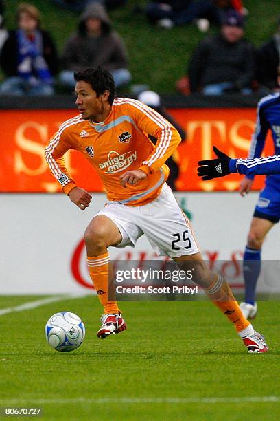 Brian Ching of the Houston Dynamo dribbles the ball against the Kansas City Wizards during the game at Community America Ballpark on April 12, 2008...