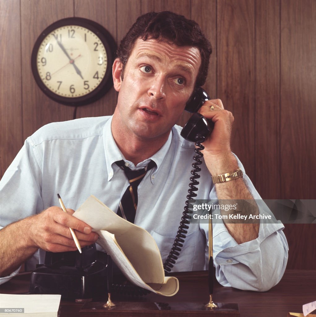 Overworked Businessman On Phone