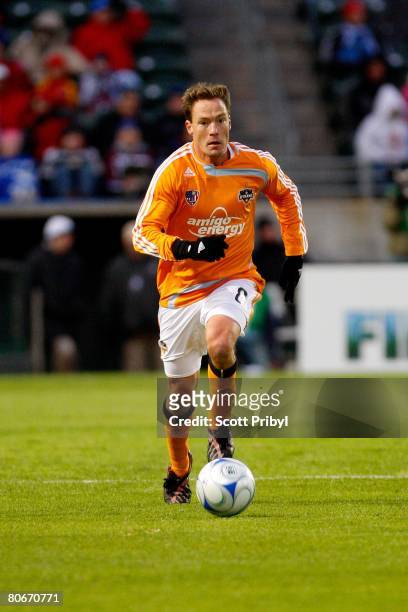 Richard Mulrooney of the Houston Dynamo dribbles against the Kansas City Wizards during the game at Community America Ballpark on April 12, 2008 in...