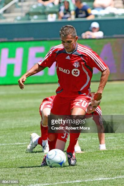 Amado Guevara of Toronto FC pushes the ball up the field during their MLS game against the Los Angeles Galaxy at the Home Depot Center on April 13,...