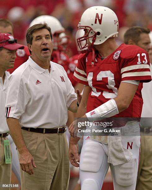 Nebraska head coach Bill Callahan talks with quarterback Zac Taylor before the Huskers take on Pittsburgh at Memorial Stadium in Lincoln, Nebraska on...