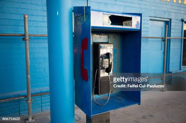 a phone box at street of las vegas, nevada state, usa - pay phone stockfoto's en -beelden