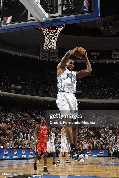 Dwight Howard of the Orlando Magic goes up for the shot during the NBA game against the Golden State Warriors at the Amway Arena on March 8, 2008 in...
