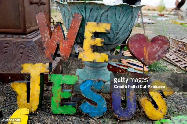 we love jesus sign for sale at spokane, washington state, usa - jesus christ photo stock pictures, royalty-free photos & images