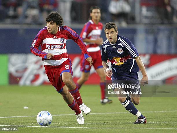 Juan Toja of FC Dallas takes the ball down field against the New York Red Bulls defense on April 12, 2008 at Pizza Hut Park in Frisco, Texas.