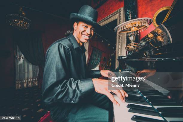 musician playing the piano in nightclub bar - jazz club stock pictures, royalty-free photos & images