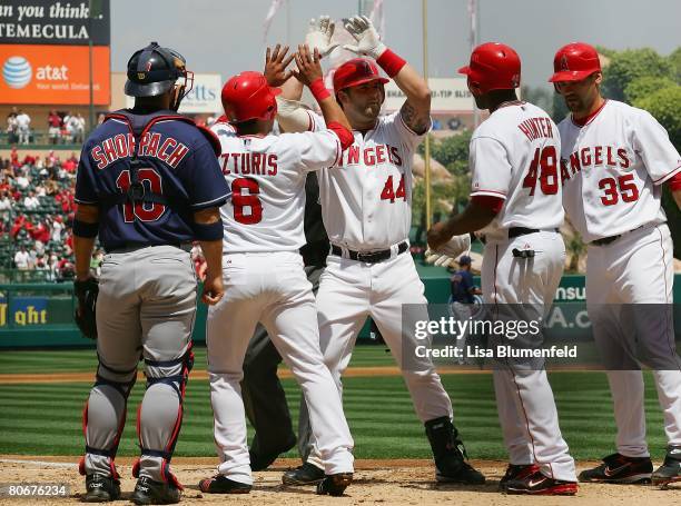 Mike Napoli of the Los Angeles Angels of Anaheim celebrates at home plate after hitting a grand slam to left center field with one out in the second...