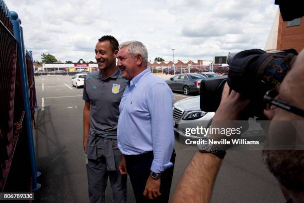 New signing John Terry of Aston Villa and Steve Bruce manager of Aston Villa pose for a picture at Villa Park on July 03, 2017 in Birmingham, England.