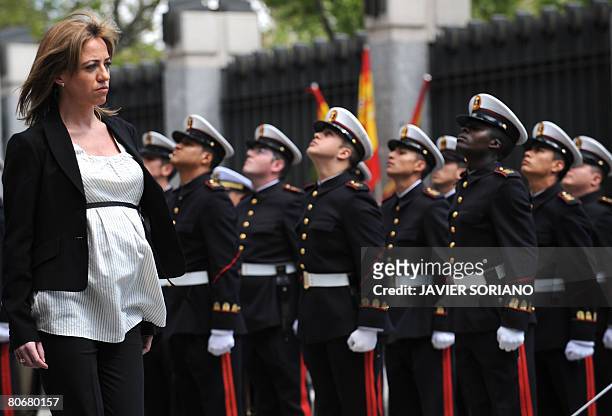 Spain's new Defence Minister Carme Chacon reviews a contingent of troops in a ceremony at the defence ministry after being sworn into office earlier...