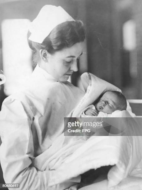 Newborn baby boy Lucien P. Smith Jr in the arms of a nurse, November 1912. Smith's mother, Eloise Hughes Smith , was pregnant while a passenger...