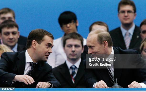 Russian President Vladimir Putin and President-elect Dmitry Medvedev speak at the United Russia party congress on April 15, 2008 in Moscow, Russia....