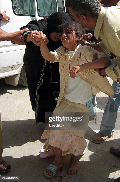 Mother and her daughter are evacuated from the site of a car bomb to the Baquba hospital on April 15, 2008. A car bomb killed 40 people and wounded...