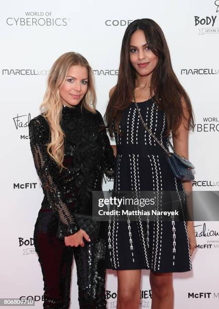 Ina Aogo and Jill Asemota during the Marcell von Berlin 'Genesis' collection presentation on July 3, 2017 in Berlin, Germany.