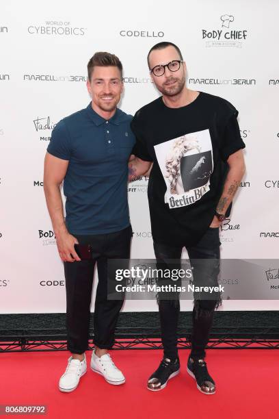 Philipp Boy and designer Marcell von Berlin during the Marcel Von Berlin 'Genesis' collection presentation on July 3, 2017 in Berlin, Germany.